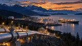 Aerial dusk view of a British Columbia coastal natural gas pipeline network leading to an LNG export terminal with tanker ship, framed by forested mountains and construction cranes symbolizing energy expansion.
