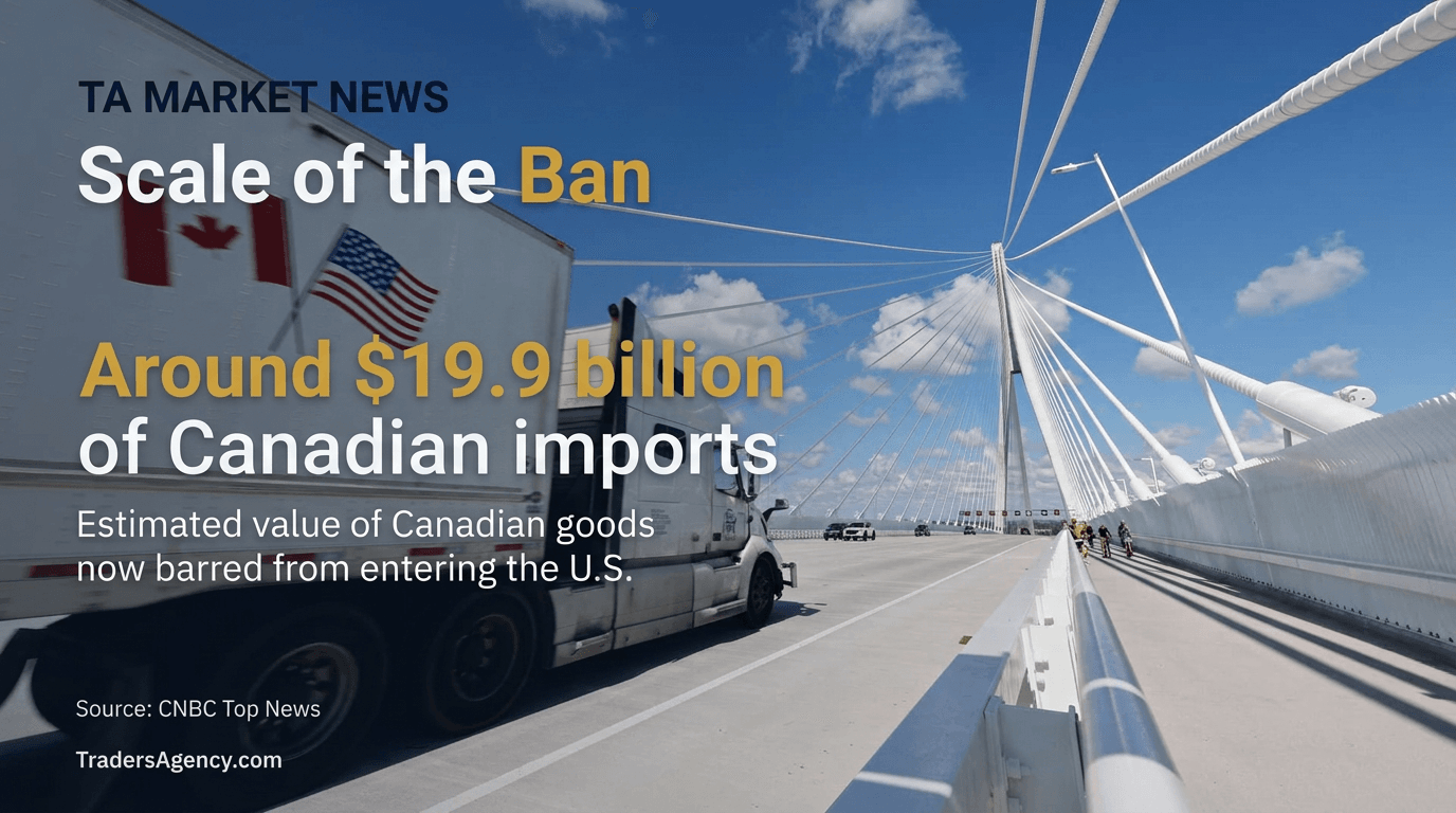 A freight truck marked with Canadian and American flags crosses a cable-stayed bridge over a border crossing.